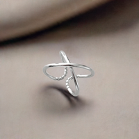 A CROSS silver ring